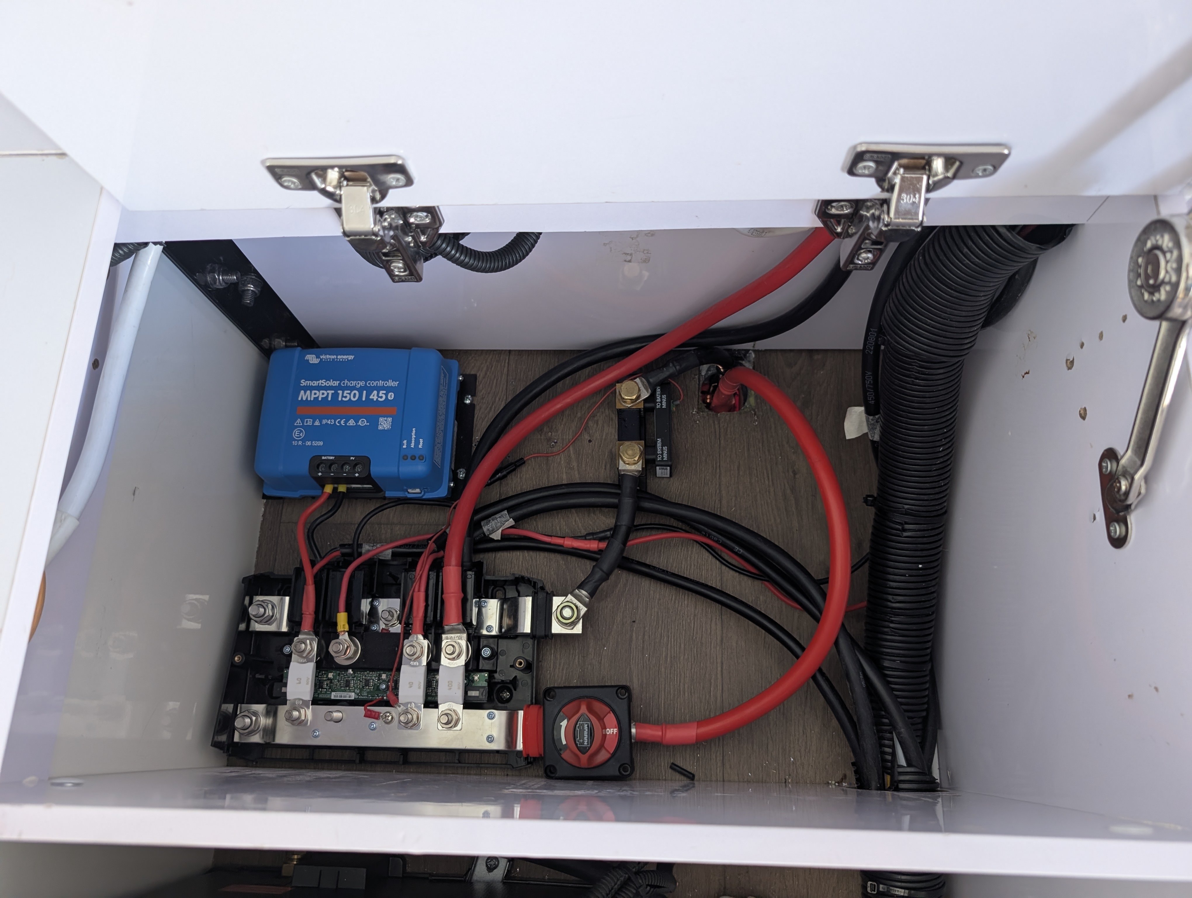 Victron MPPT charge controller and distribution busbar wiring close-up