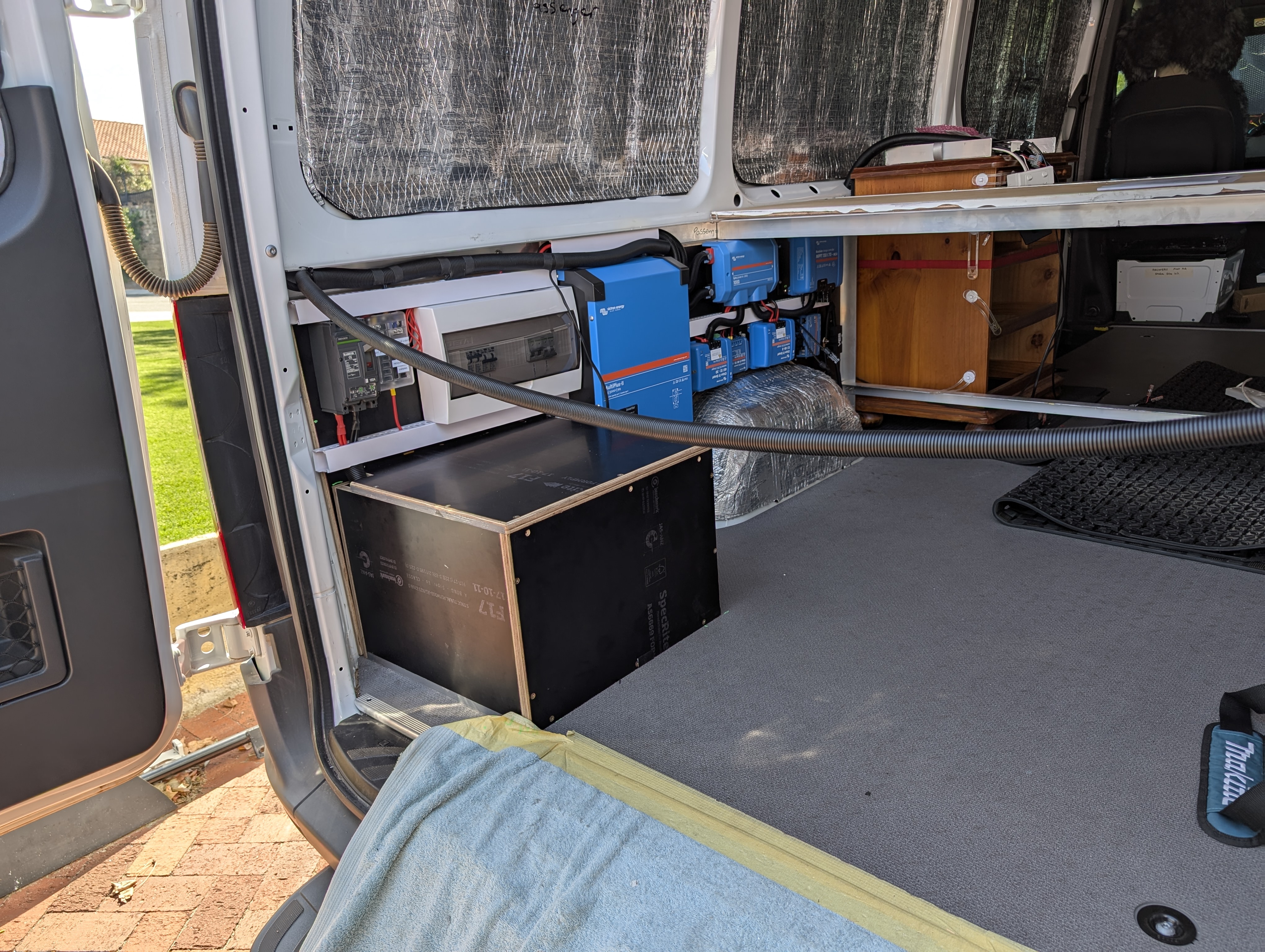 Rooftop fan installation on a white campervan